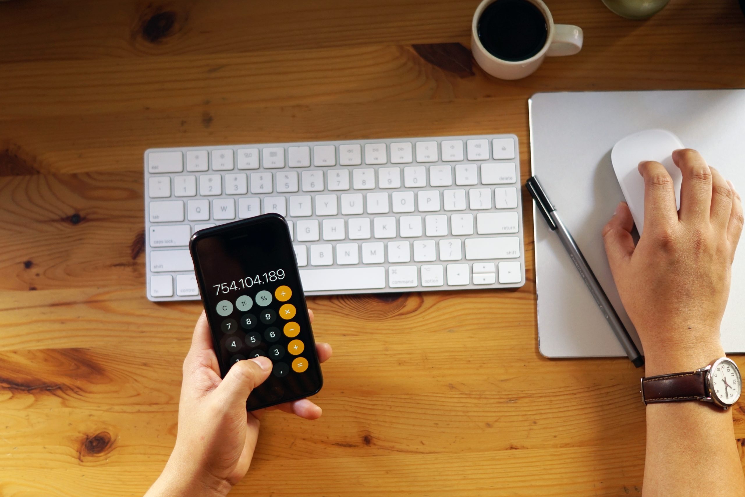 A closeup shot of an entrepreneur working from home and doing calculations